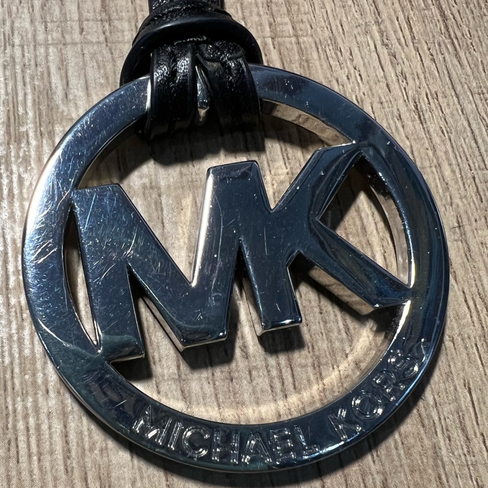 Michael Kors Black and silver bag tag charm